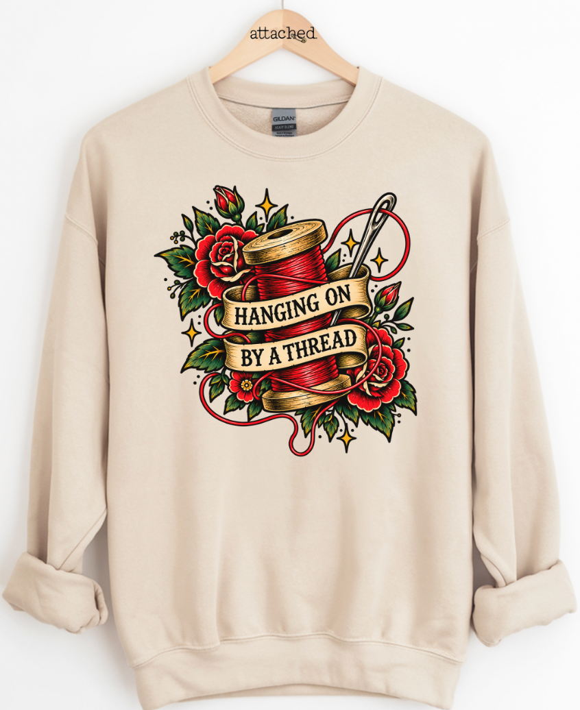 Hanging On By A Thread Traditional Graphic Top